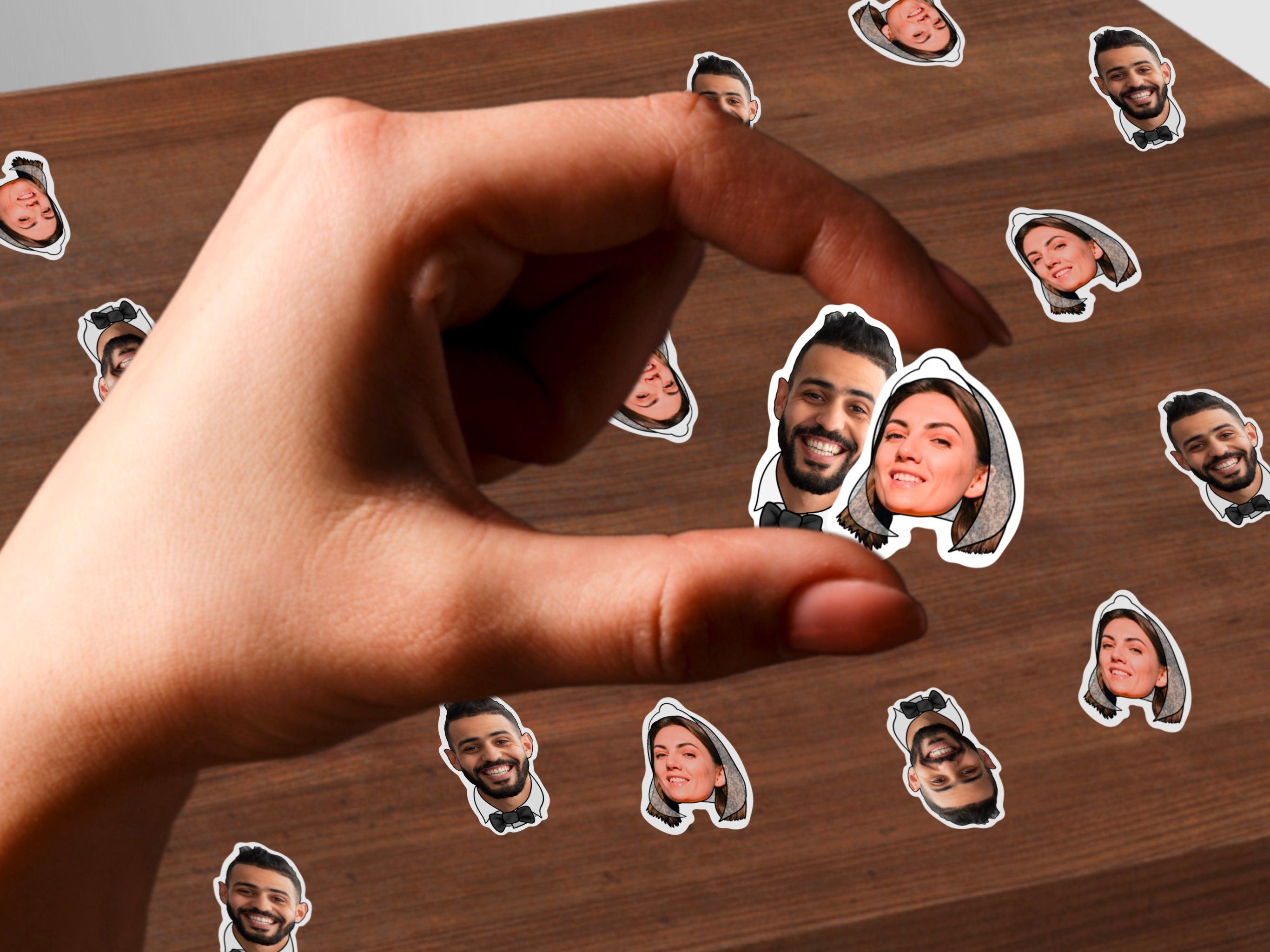 Personalised confetti with photos of the bride and groom, featuring a bow tie on the groom and a veil on the bride. The confetti features multiple small cutouts of photos, each showcasing the faces of the couple.