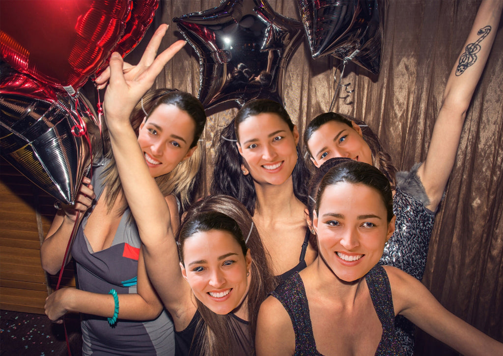 A lively group of women celebrating a hen do, wearing masks featuring the face of the bride-to-be, creating a playful and memorable atmosphere.