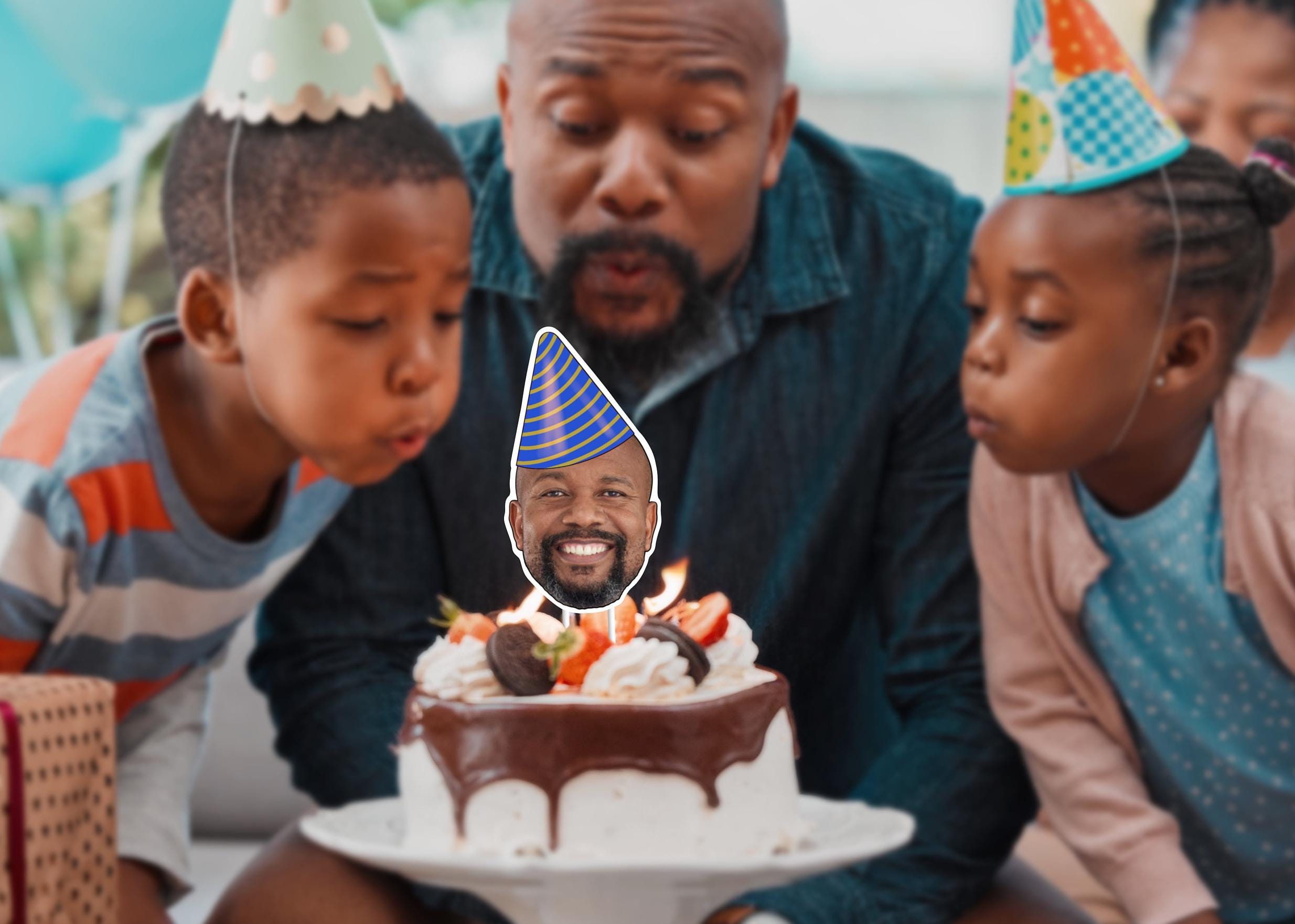 A custom cake topper showcasing a photo of a man’s head placed on top of the cake. The topper features the person wearing a festive party hat, adding a celebratory touch to the cake decoration. A fab addition to any party or special occasion.