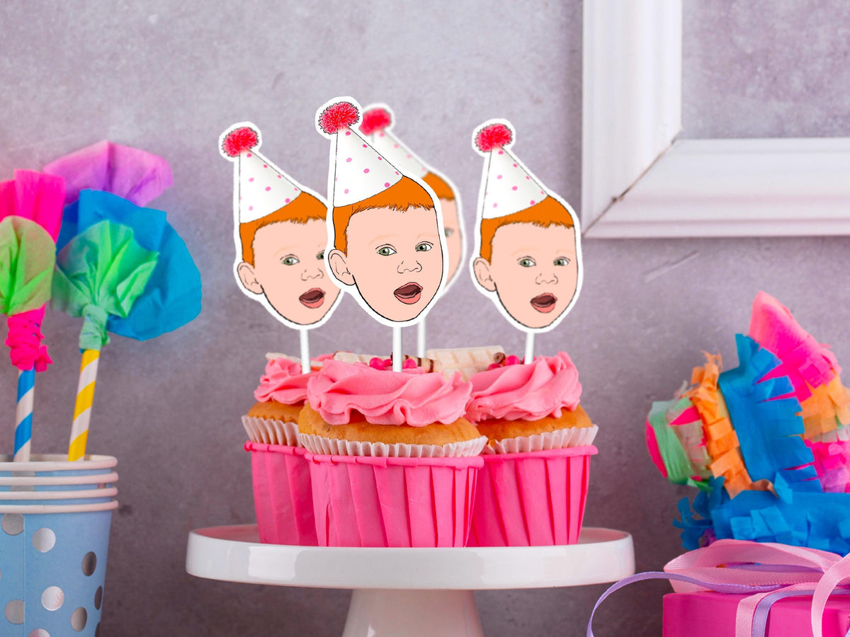 Custom illustrated baby face cupcake toppers with party hats. Personalised decorations for birthdays and baby celebrations.