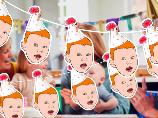 Personalised illustrated baby party banner featuring custom cartoon faces with pink party hats. Handmade from your photo – perfect for first birthdays, baby showers, and celebrations.