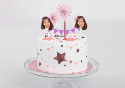 Birthday party cake with custom face bunting topper, pink and purple accents, and gold balloon backdrop. Perfect personalised decoration for birthdays, weddings, and celebrations.