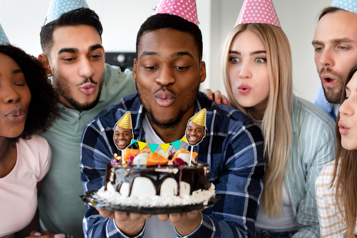 Group birthday celebration with chocolate cake featuring a custom face bunting topper, gold party hats, and colourful bunting. Perfect personalised cake decoration for parties and events.